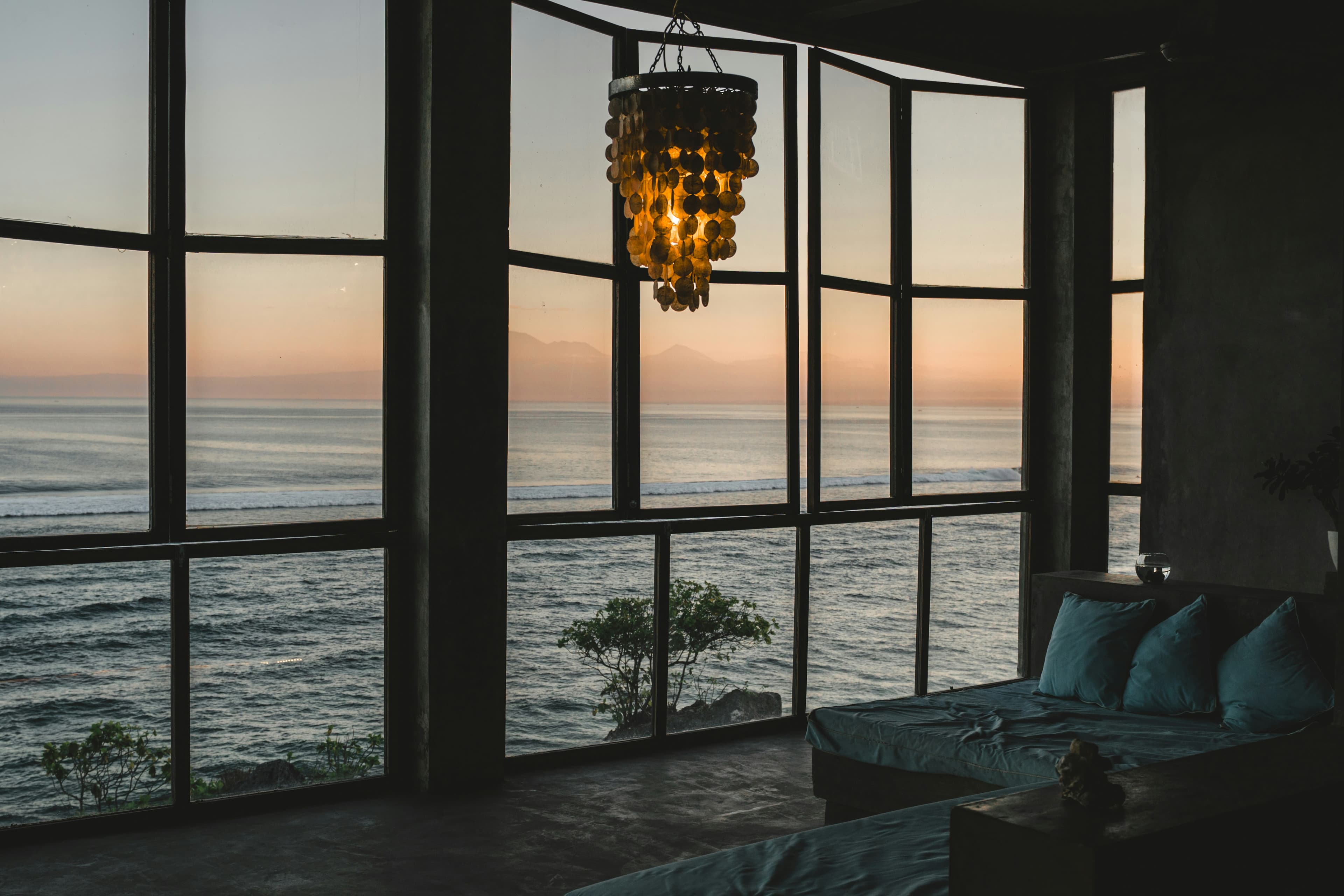 Warmly lit modern lounge at dusk